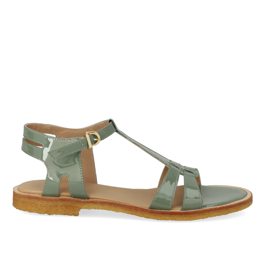 Feminine sandal with strap design