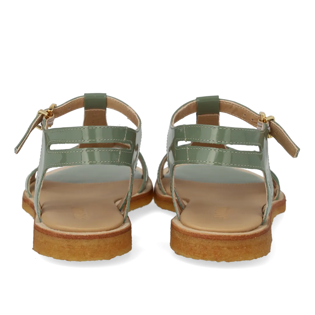Feminine sandal with strap design
