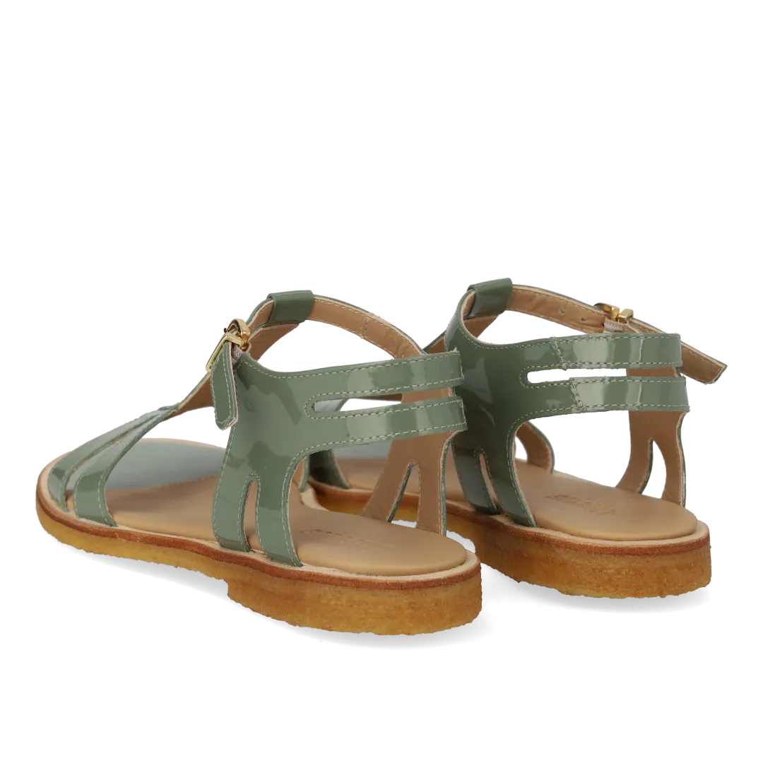 Feminine sandal with strap design